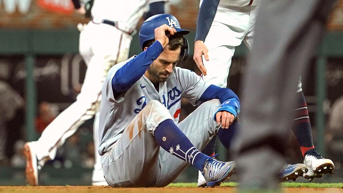 Chris Taylor walking off the baseball field in Los Angeles Dodgers uniform