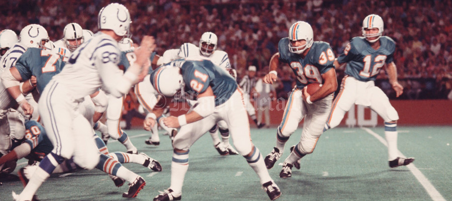 Old Miami Dolphins game action during a classic NFL match.