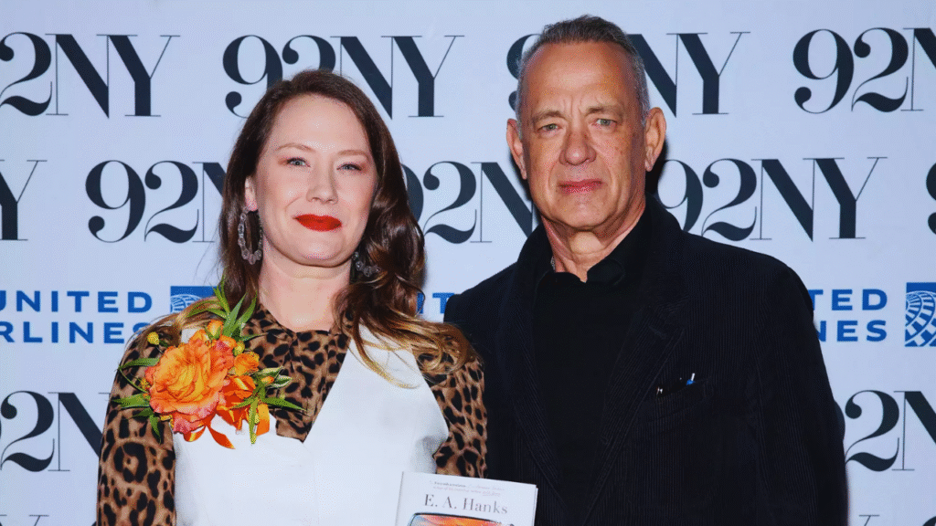 Tom Hanks smiling with daughter E.A. Hanks at public event