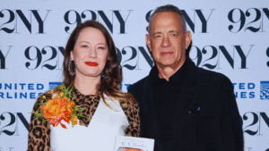 Tom Hanks smiling with daughter E.A. Hanks at public event