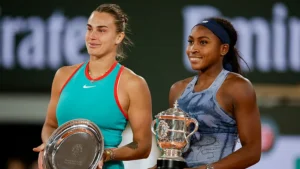 Coco and Aryna are holding trophies.