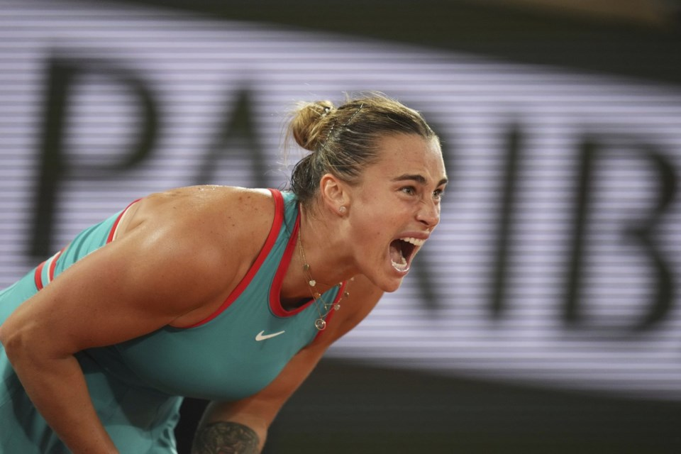 Sabalenka showing frustration during her final match at the 2025 French Open against Coco Gauff, struggling with unforced errors and windy conditions.